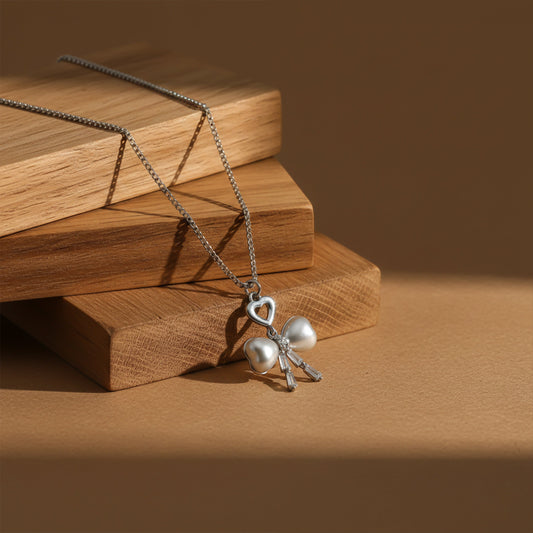 Elegant Silver Heart & Pearl Bow Necklace jewellery product view 1